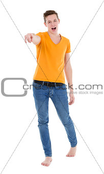 Young man wearing a yellow T-shirt and slim jeans