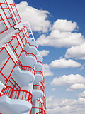 high modern residential building on a background sky and clouds