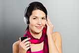 Beautiful trendy woman listening to music