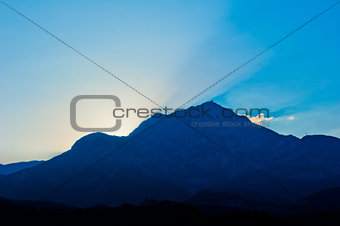 sun sets over the mountain TahtalÄ±, Turkey