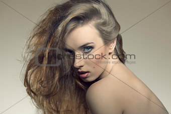 close-up of girl with bushy hairdo 