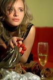 girl with beads and glass of wine