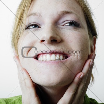 Woman touching face