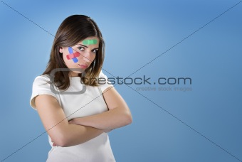 Woman with bandages on the face