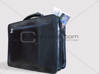 A Casual Briefcase and a Newspaper Inside It