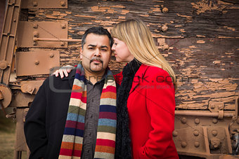Mixed Race Couple Portrait in Winter Clothing Against Rustic Tra