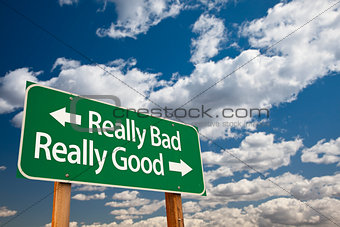 Really Bad, Really Good Green Road Sign and Clouds