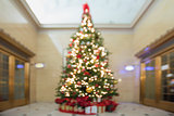 Christmas Tree with Decorations and Wrapped Gifts Bokeh