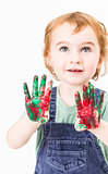 cute little girl with finger paint looking up