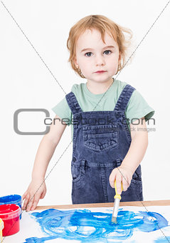 cute girl painting on small desk