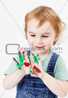 cute little girl with finger paint