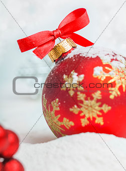 Christmas ball with red bow and ribbon