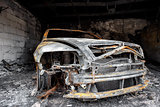 Close up photo of a burned out car