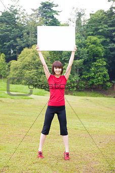 Outdoor Asian girl with placard