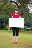 Asian girl holding a placard outdoor