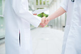 Medical doctors shaking hands
