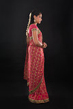 Full body side view of traditional young Indian girl
