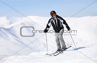 Portrait of skier on mountain slope