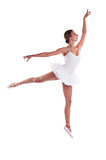 Young Caucasian ballerina jumping against white