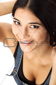 Closeup of a beautiful young woman looking up over white