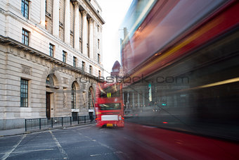 Red Bus in motion in City of London