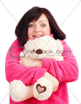 Young Woman in Pink Bathrobe Cuddling with her Teddy Bear
