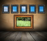 ancient wooden frames on grunge wall