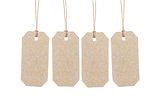 four brown tags hanging on ropes