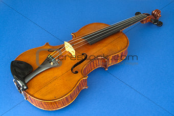 Violin against a blue background