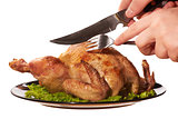 Roasted chicken being cut by a man