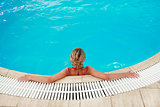 girl in blue water pool