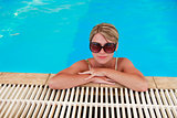 girl in blue water pool in glasses Sun Protection