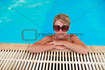 girl in blue water pool in glasses Sun Protection