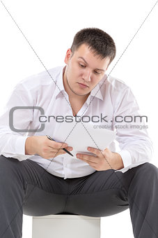 Businessman reading a report with scepticism