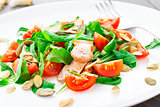 Salad with arugula, salmon and cherry tomato