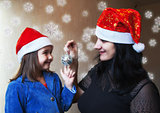 mother and daughter in santa hats