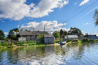 Russian wooden houses at river bank