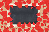blank chalkboard over Valentine hearts background