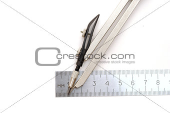 compasses and ruler on a white paper