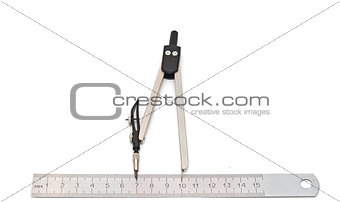 Metal measuring devices against a white background including rul