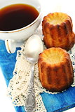 French small cake and cup of tea.