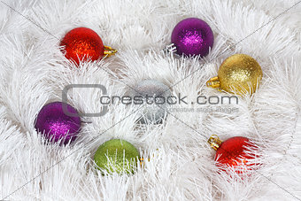 Christmas wreath of tinsel and colored balls as a texture