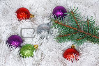Christmas wreath of tinsel and colored balls with pine branch
