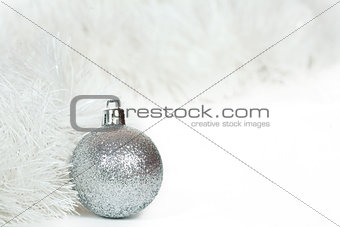 Silvery  ball and white Christmas tinsel
