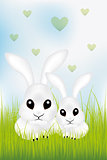 Adorable Easter rabbits in green grass