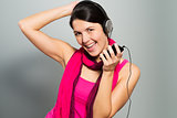 Beautiful vivacious woman listening to music