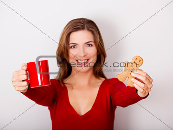 Woman drinking coffee with cookies