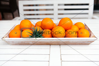 fresh orange fruits decorative on table in summer