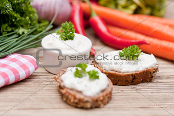 fresh tasty homemade cream cheese and herbs with bread