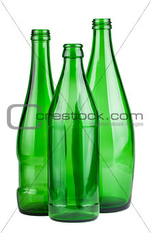 Three green empty bottles